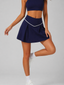 Avrane Wren Tennis Skirt - women's V-waist pleated tennis skort with contrast trim in navy blue