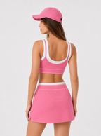 Avrane The Cora pink layered sports bra and A-line court skirt set with white contrast trim