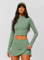 Avrane The Elara green half-zip long-sleeve top and side-slit court skirt set