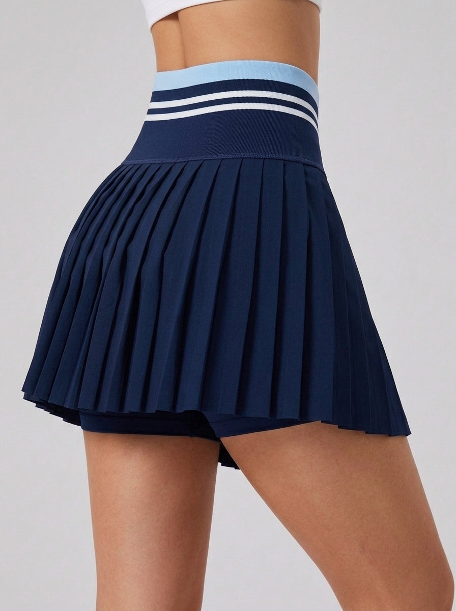 Avrane The Blair navy pleated performance skort with light blue contrast waistband